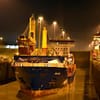 A ship enters the Panama Canal at night