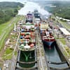 Container ships pass through the Gatun Locks of the Panama Canal