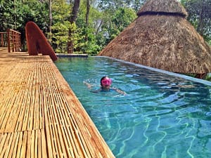 A Child swims in a pool at Isla Palenque Resort, Panama