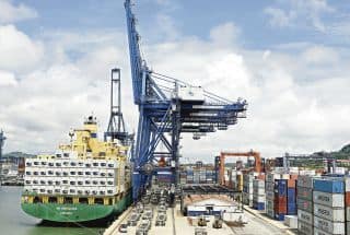 Panama container ship in Colon loads cargo.