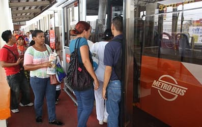 Patrons board a Metro Bus in Panama which are modern and air conditioned.